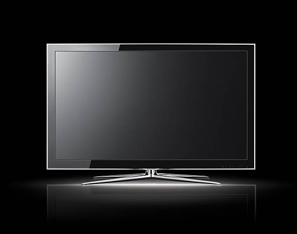 3D view of modern LCD TV on black background Modern lcd tv on the dark background home recording studio setup stock pictures, royalty-free photos & images