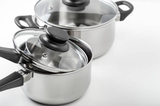 istock Stainless steel pots and pans isolated on white 1494570324