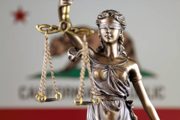 Symbol of law and justice with California State Flag. Close up. stock photo