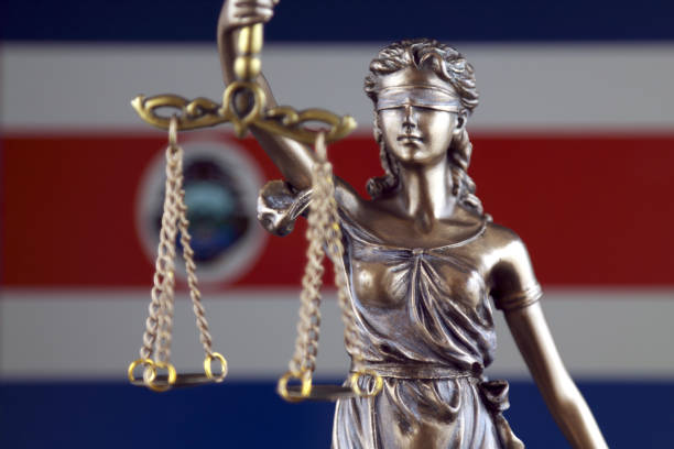 Symbol of law and justice with Costa Rica Flag. Close up. stock photo