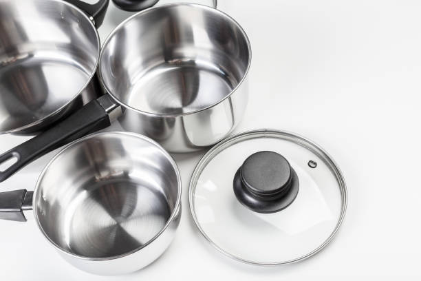 istock Stainless steel pots and pans isolated on white 1494570810