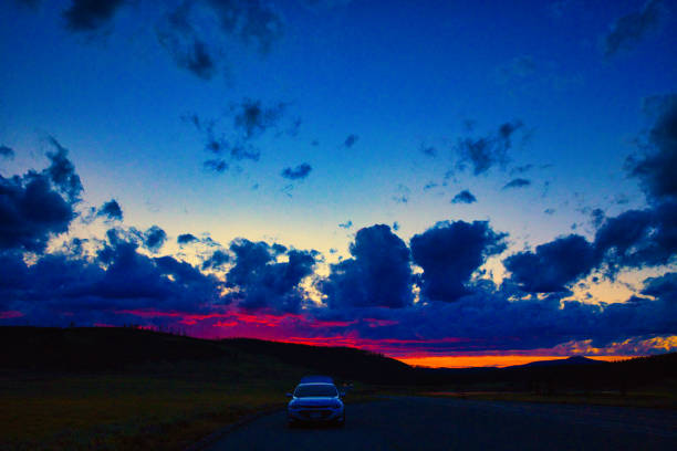 Driving on a highway in deep twilight.