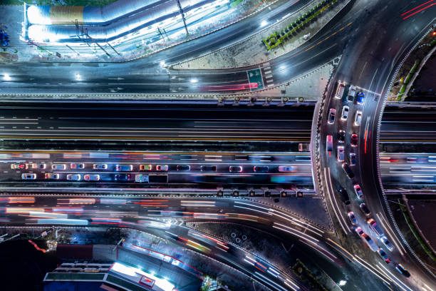 istock Expressway top view, Road traffic an important infrastructure, Drone aerial view fly in circle, traffic transportation, Public transport or commuter city life concept of economic and energ, transport. 1494577161