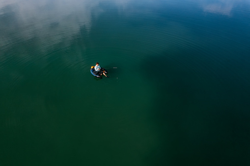 Aerial View of Man Fishing in Float Boat