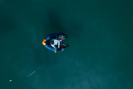 Aerial View of Man Fishing in Float Boat