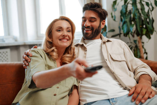 istock Couple with dog at home 1494578320