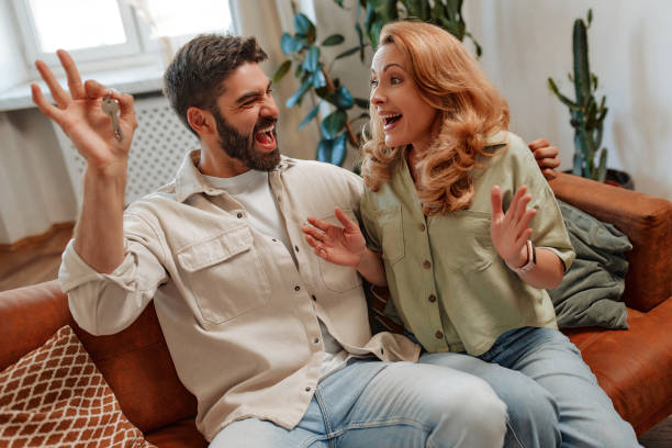 istock Couple with dog at home 1494578322