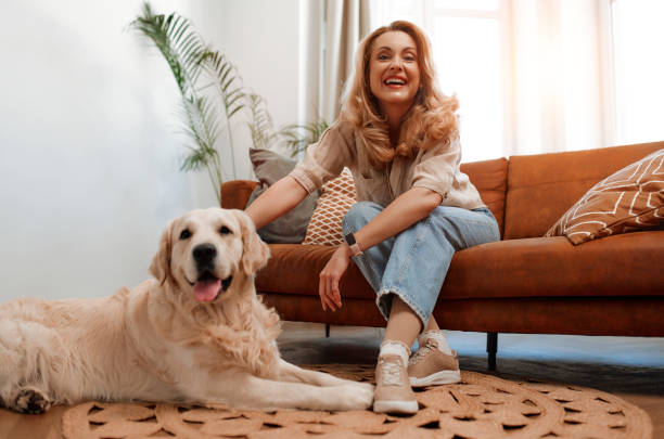 istock Couple with dog at home 1494578341