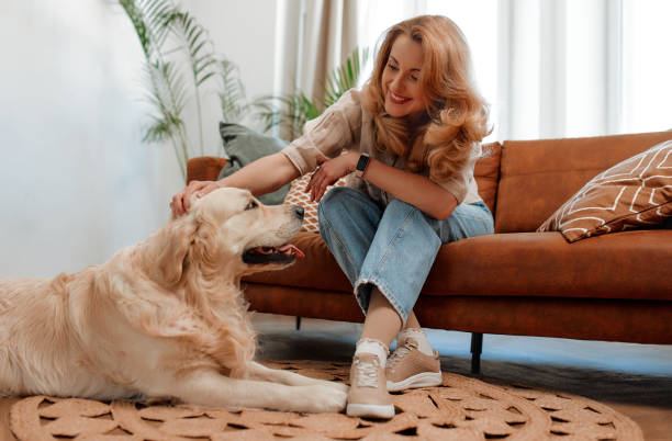 istock Couple with dog at home 1494578342