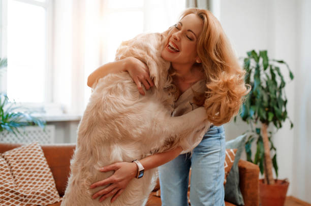 istock Couple with dog at home 1494578365