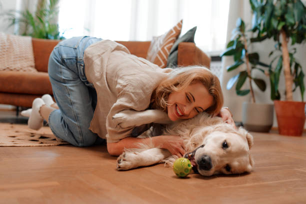 istock Couple with dog at home 1494578435