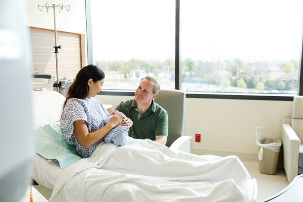istock Multiracial couple admires their newborn 1494578444
