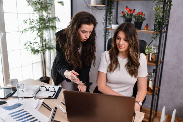 istock Female Assistant In Company Getting Advice From Senior Employee 1494578471