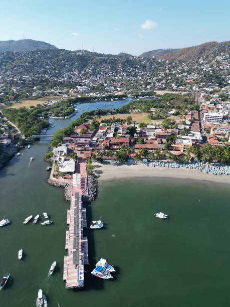 istock Bird's Eye View: Zihuatanejo Dock and Cityscape - Vertical Drone Image 1494578472