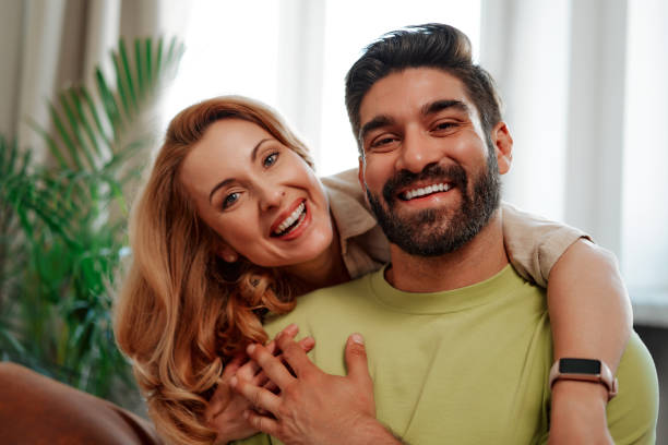 istock Couple with dog at home 1494578553