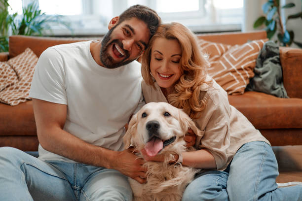 istock Couple with dog at home 1494578612