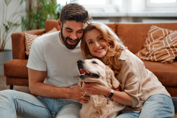 istock Couple with dog at home 1494578616