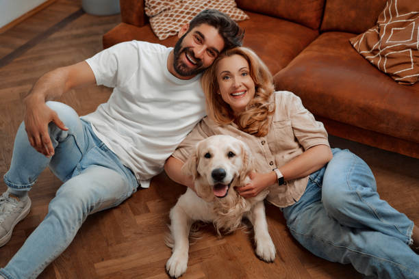 istock Couple with dog at home 1494578646