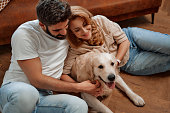 Couple with dog at home