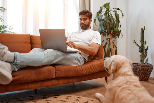 istock Couple with dog at home 1494578711