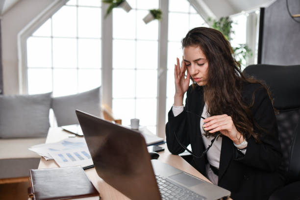 istock Headache Catching Up With Businesswoman Working Hard 1494579045