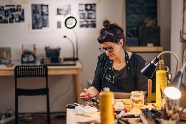 istock A female jeweler makes jewelry in her workshop 1494579104