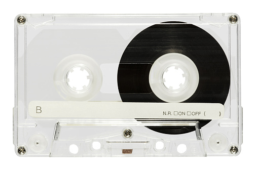Top view of vintage audio cassette with tape and inscription isolated on white background