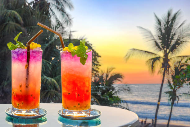 drinks with blur beach and sunset in background drinks with blur beach and sunset in background beach goa party stock pictures, royalty-free photos & images