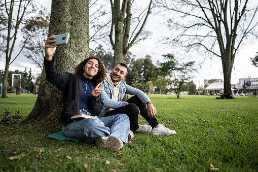 Young couple taking a selfie in the public park