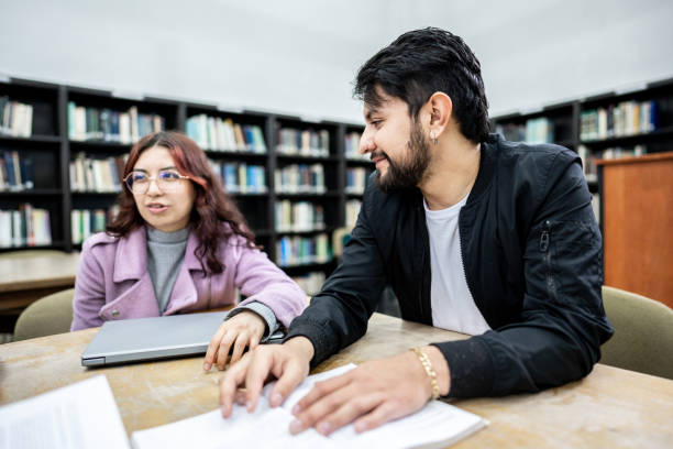 istock Student friends talking on library in the university 1494581039