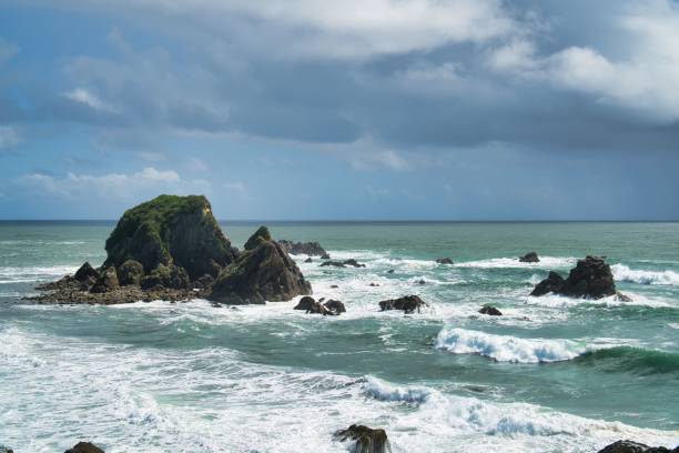 istock this is an image of rocky shore under a blue sky 1494581088