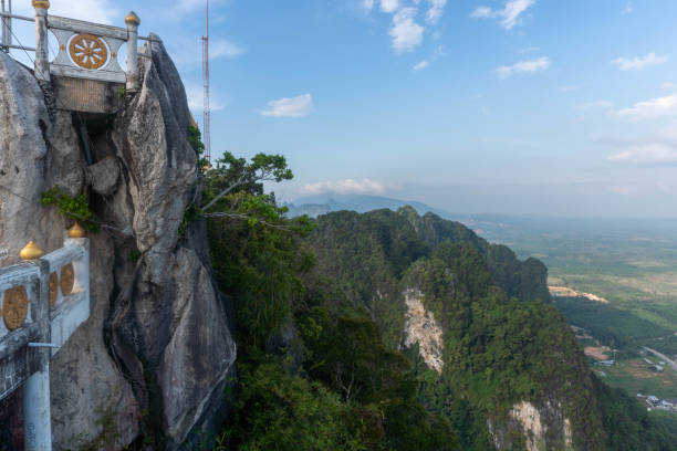 istock Landscape view on mountains and fields with vegetation, from Tiger Cave Temple ( Wat Tham Suea) in Krabi, Thailand. 1494581329