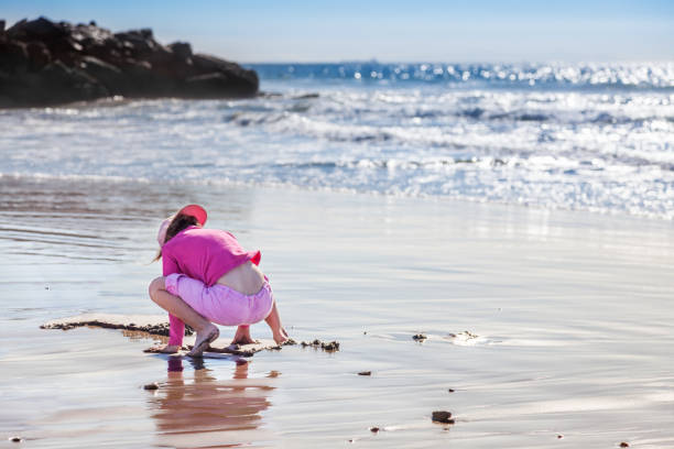 istock Little girl plays in the sand 1494582806