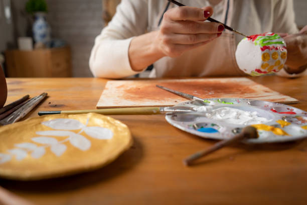 istock Woman painting a pottery 1494582946