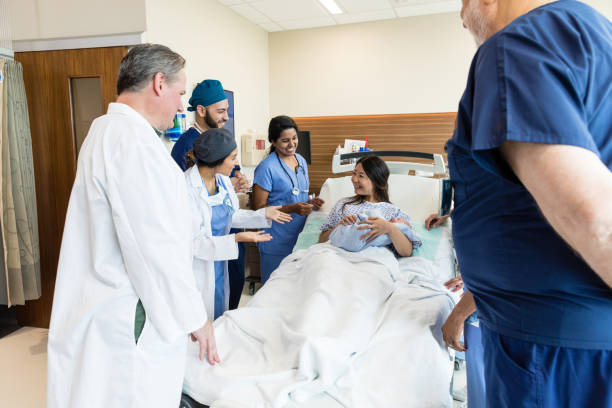 istock Diverse emergency room team congratulates woman after birth 1494582953