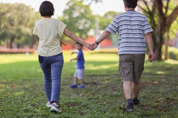 istock Son and parents playing outside the park 1494584490