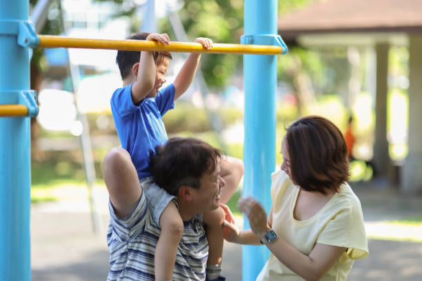 istock Son and parents playing outside the park 1494584517