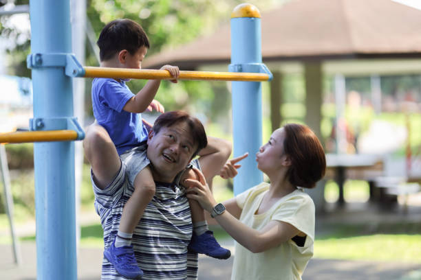 istock Son and parents playing outside the park 1494584524
