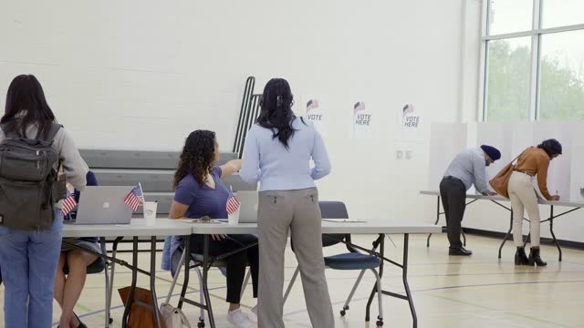 Helpful volunteer working at polling place
