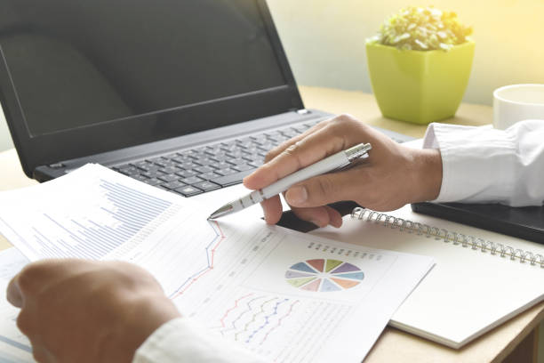 istock business man working with graphs and charts report on desk in office. 1494588846