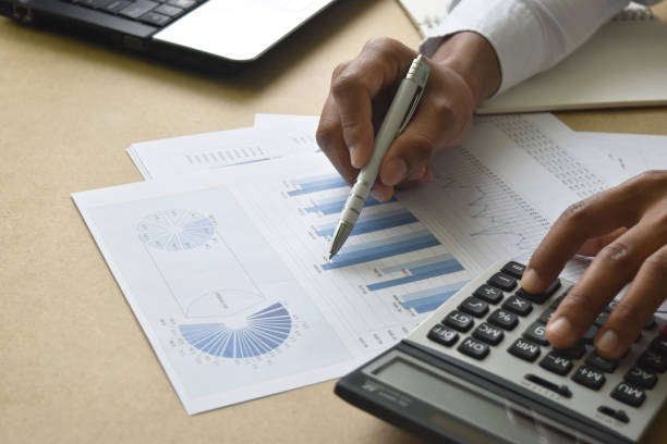 istock business man working with graphs and charts report on desk in office. 1494588852