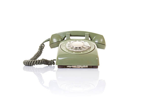 Old green telephone Old green telephone on isolated white background with perfect reflection bakelite stock pictures, royalty-free photos & images