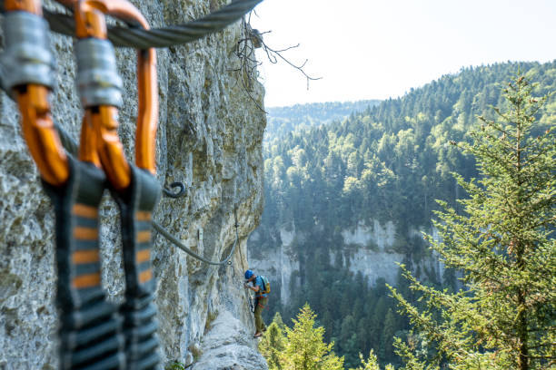 istock Distant view of climber on Via Ferrata, spectacular rock face 1494589826