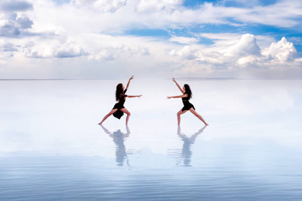 istock Ballerinas dancing on the lake 1494589918