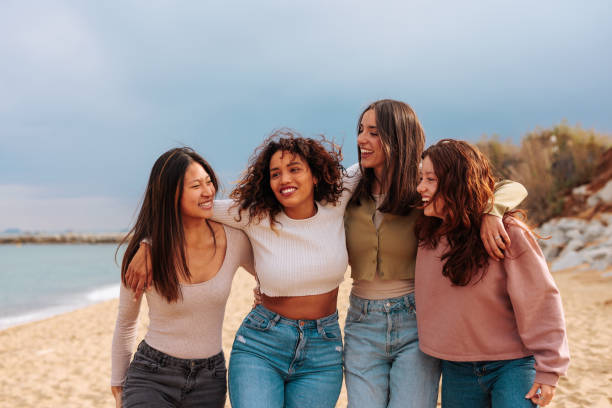 istock Four multiracial girls reunited on beach 1494590196