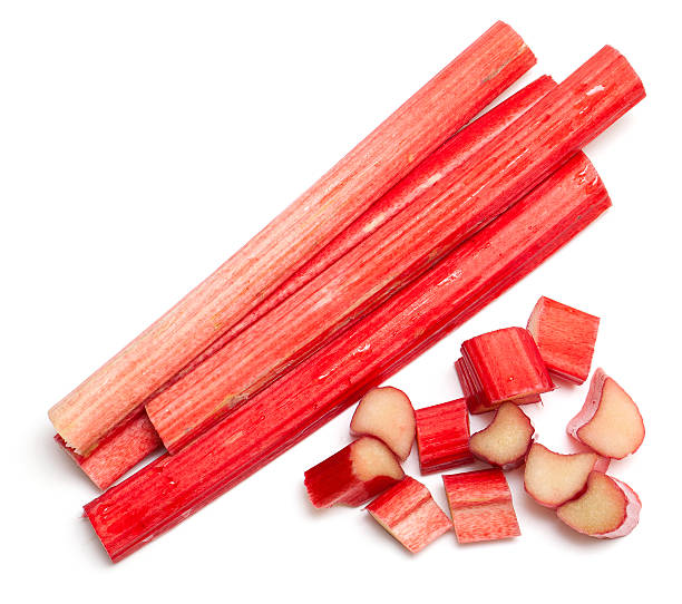 cut rhubarb sticks cut rhubarb sticks isolated on white background rhubarb stock pictures, royalty-free photos & images