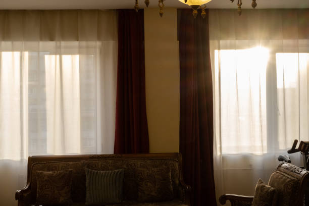 istock Sunlight through the curtain in living room 1494595705