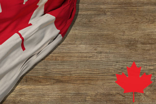 canadian red and white maple leaf flag against dark wood rustic background for canada day, july 1, celebration and national holidays. - flag canada canadian flag maple leaf imagens e fotografias de stock