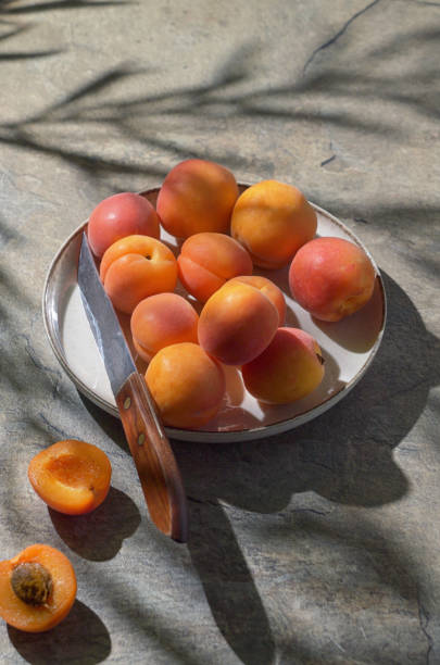 istock Ripe Sweet Apricots On Stone Table 1494597180