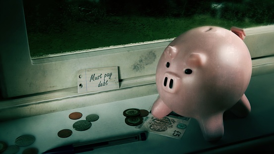 A photorealistic 3D scene depicting a noted reminder to pay off some debts.